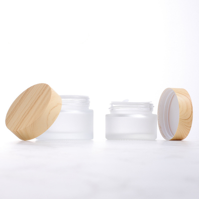 Wholesale 5g 10g 15g 30g 50g 100g Cosmetic Empty Clear Frosted Glass Cosmetic Jars With Wood Grain Lids
