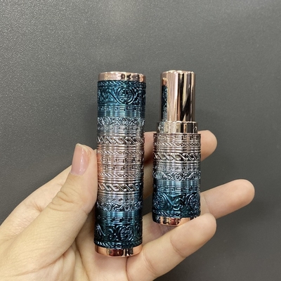 Round lipstick tube with delicate cutting pattern in stock low moq luxury new lipstick tube packaging with cutting out decorative pattern new design heavy weight
